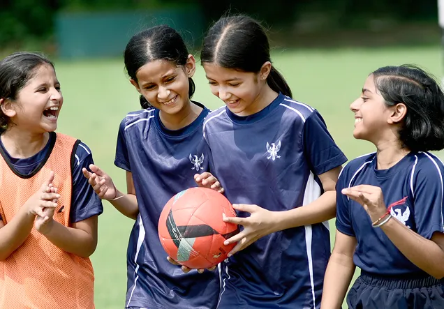 School girls playing football